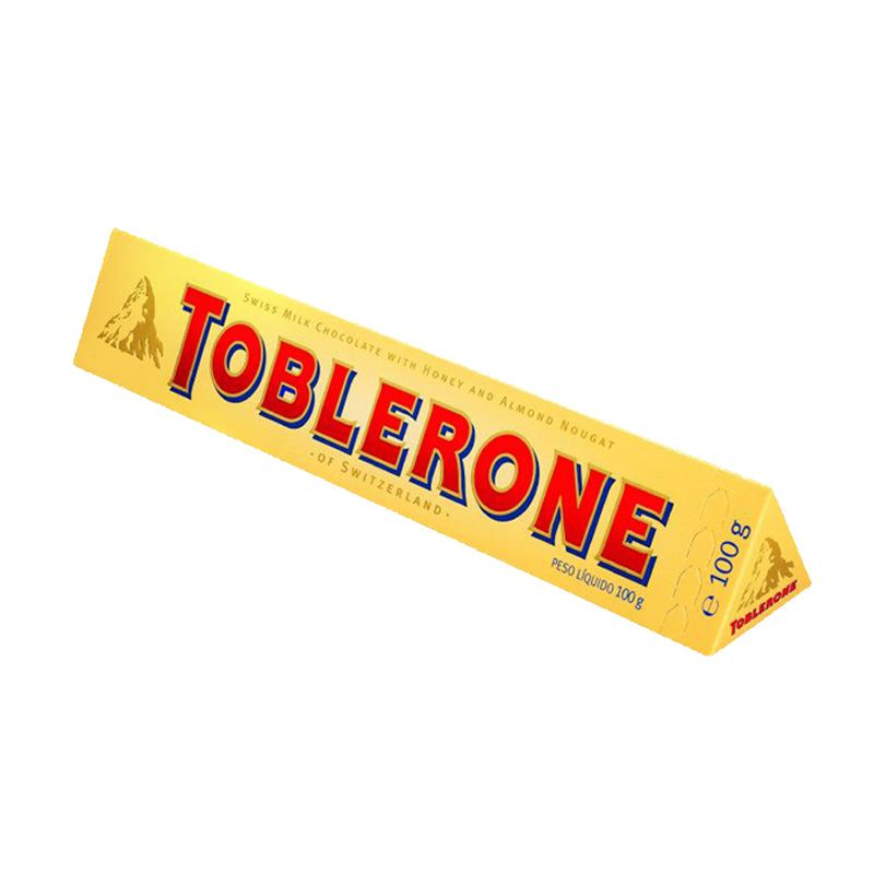 A 100g bar of Toblerone Chocolate Milk, predominantly yellow packaging with the Toblerone logo in red and blue.