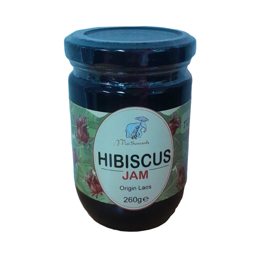 Jar of hibiscus jam with a blue lid on a white background