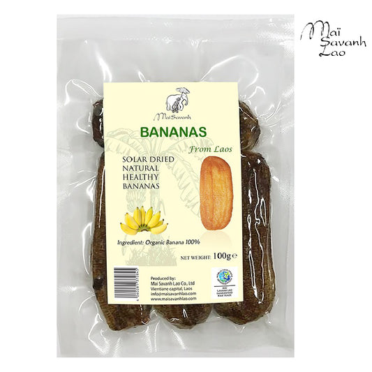 Packaged solar-dried bananas with the brand 'Mai Savanh Lao' visible on the label, indicating organic and fair-trade standards.