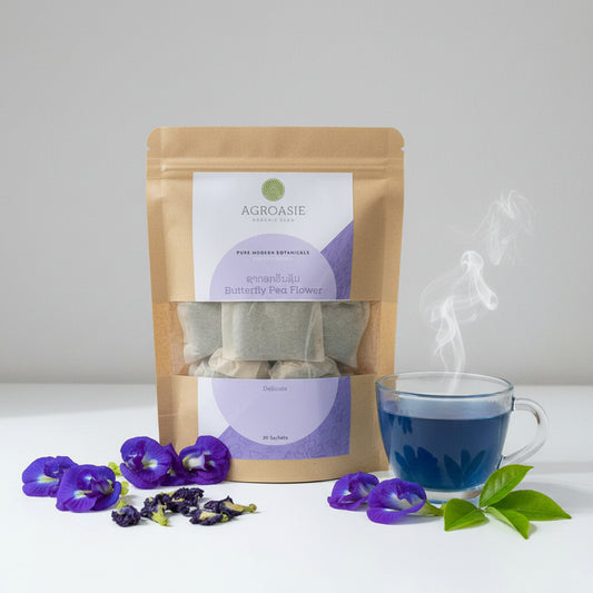 Agroasic tea packages with visible branding on a neutral background