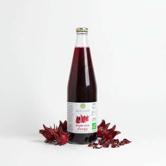 Bottle of Agroasia Rosella drink on a white surface with a white background