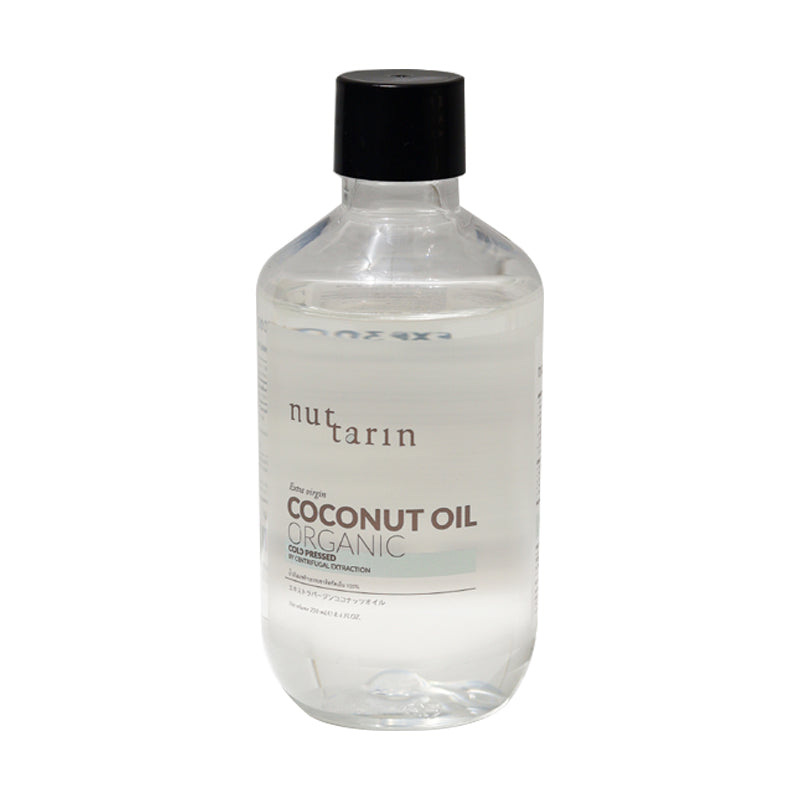 A 250ml bottle of Nuttarin Extra Virgin Coconut Oil with the label showing the product name and organic certification.