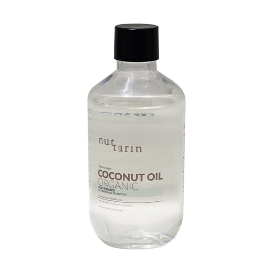 A 250ml bottle of Nuttarin Extra Virgin Coconut Oil with the label showing the product name and organic certification.