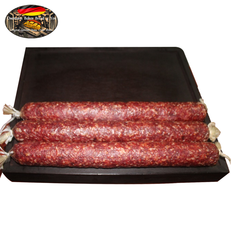 A photo showing several links of salami on a tray, which are part of the 'Salami Klein Stück Nr. 10' product.