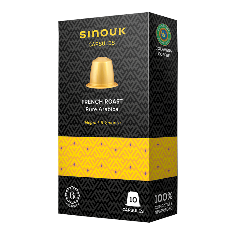 A box of Sinouk Coffee French Roast Pure Arabica capsules with a gold and black color scheme and the brand logo visible.