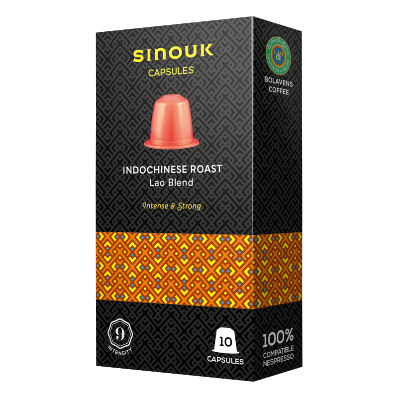 A box of Sinouk Coffee Indochinese Roast Lao Blend 9Intensity 10 Capsules with a visual of a single capsule in front, against a patterned background.